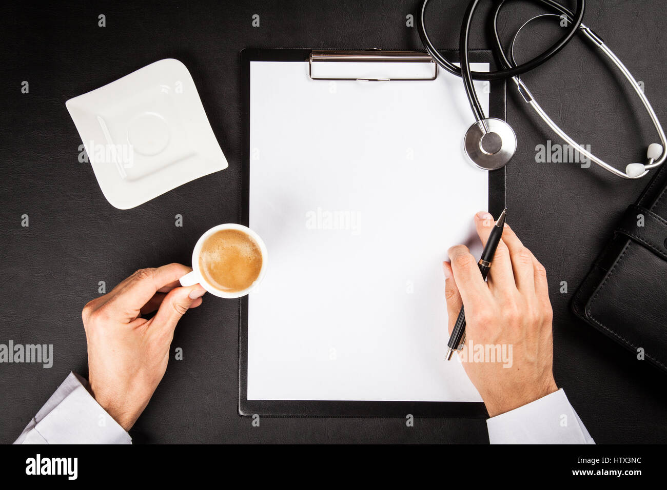 Doctor's working table Stock Photo - Alamy