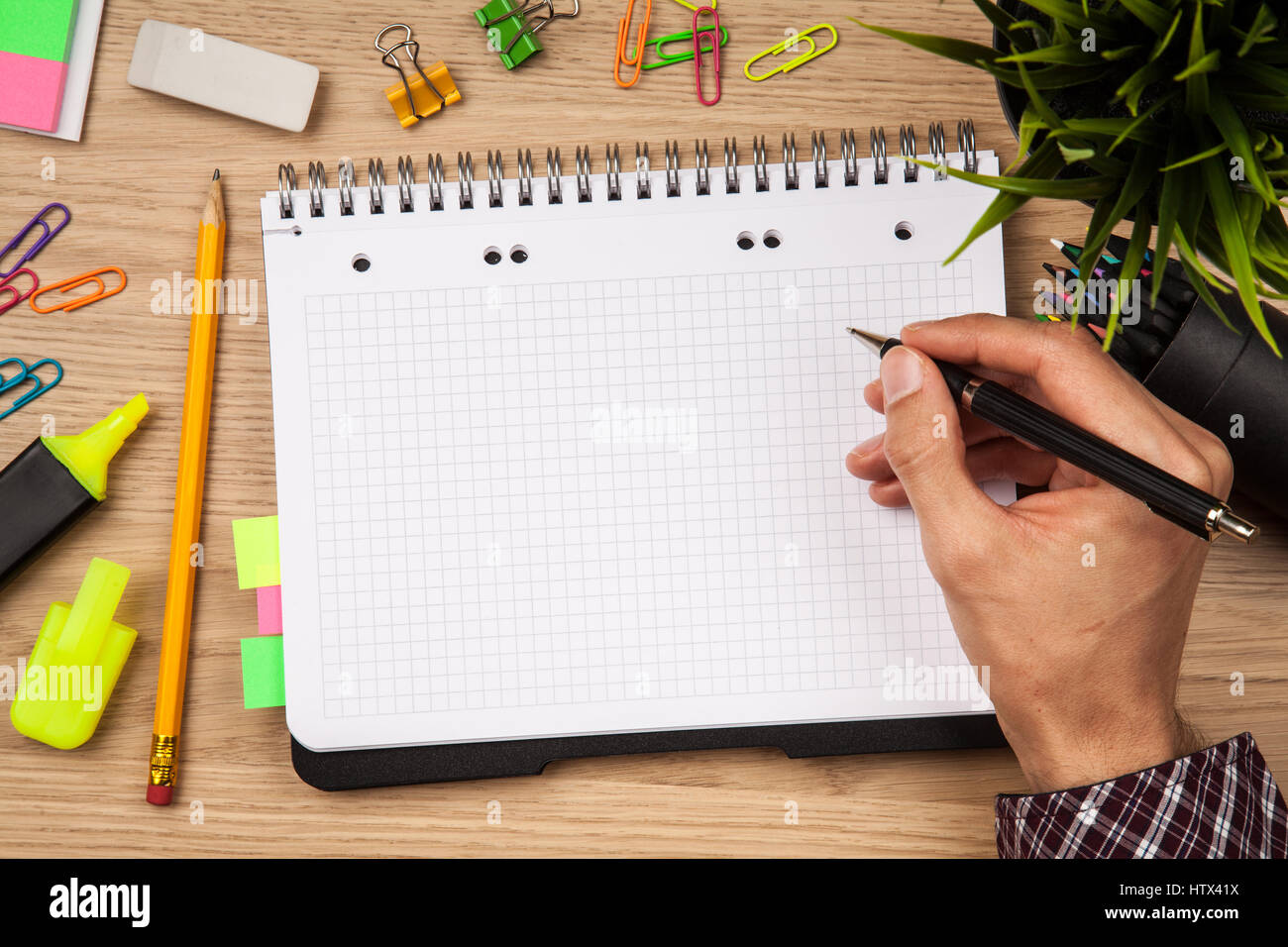 Open notepad with office supplies Stock Photo Alamy