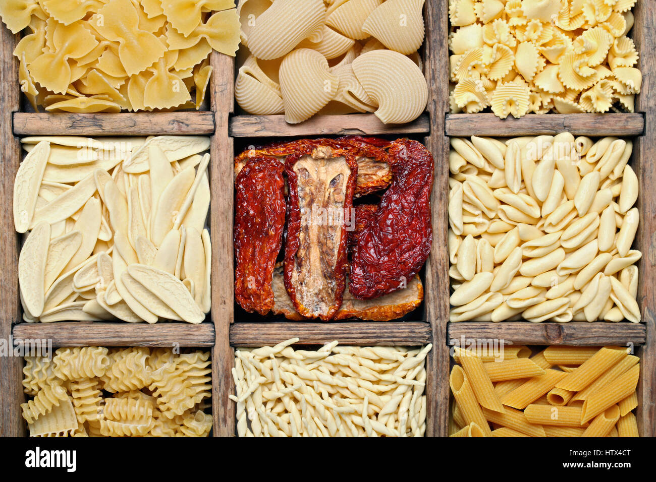 Background image of italian pasta. Various pasta in a wooden antique box Stock Photo