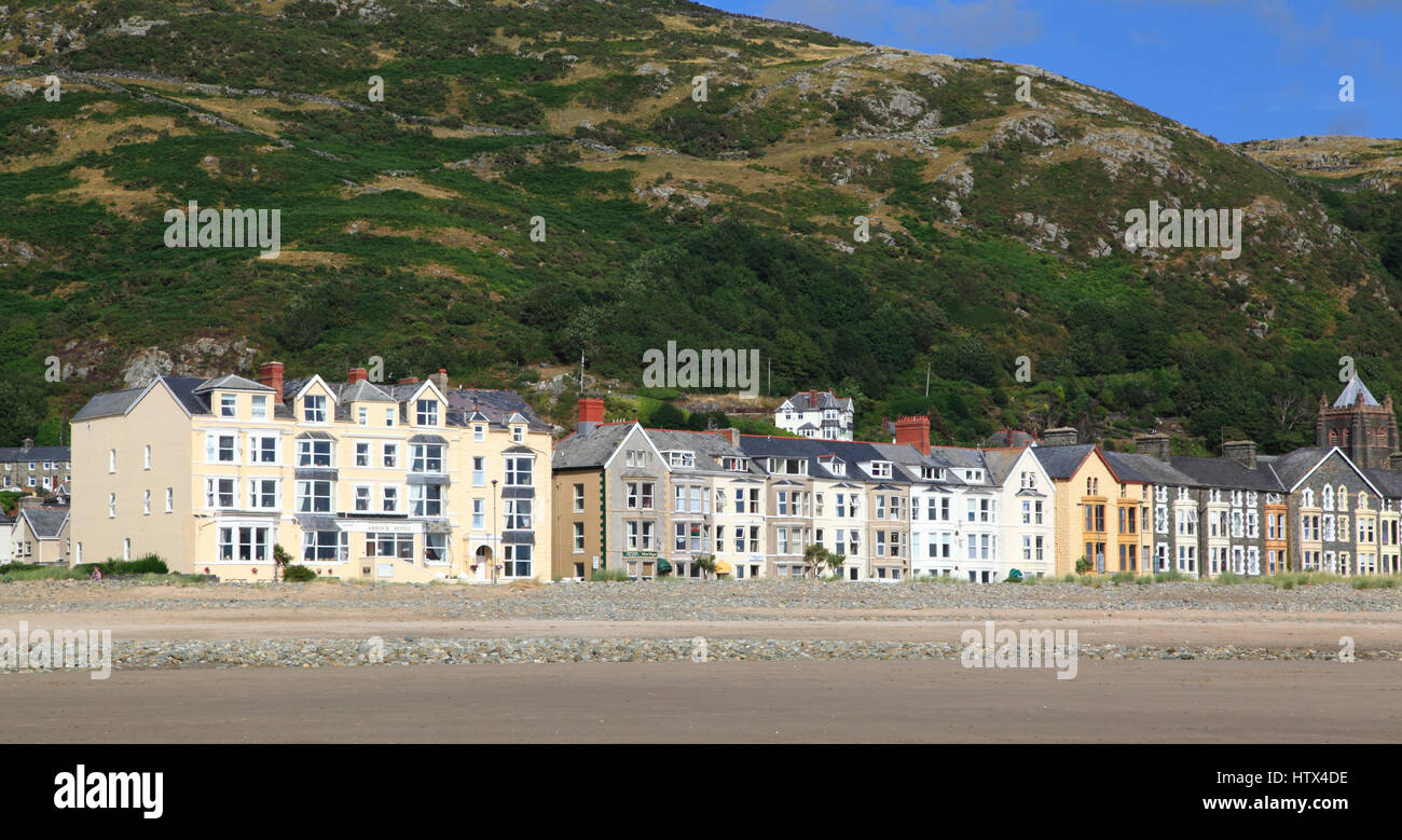 Homes and hotels along the seafront with Dinas Oleu in the background , Barmouth, Gwynedd, Wales, Europe Stock Photo