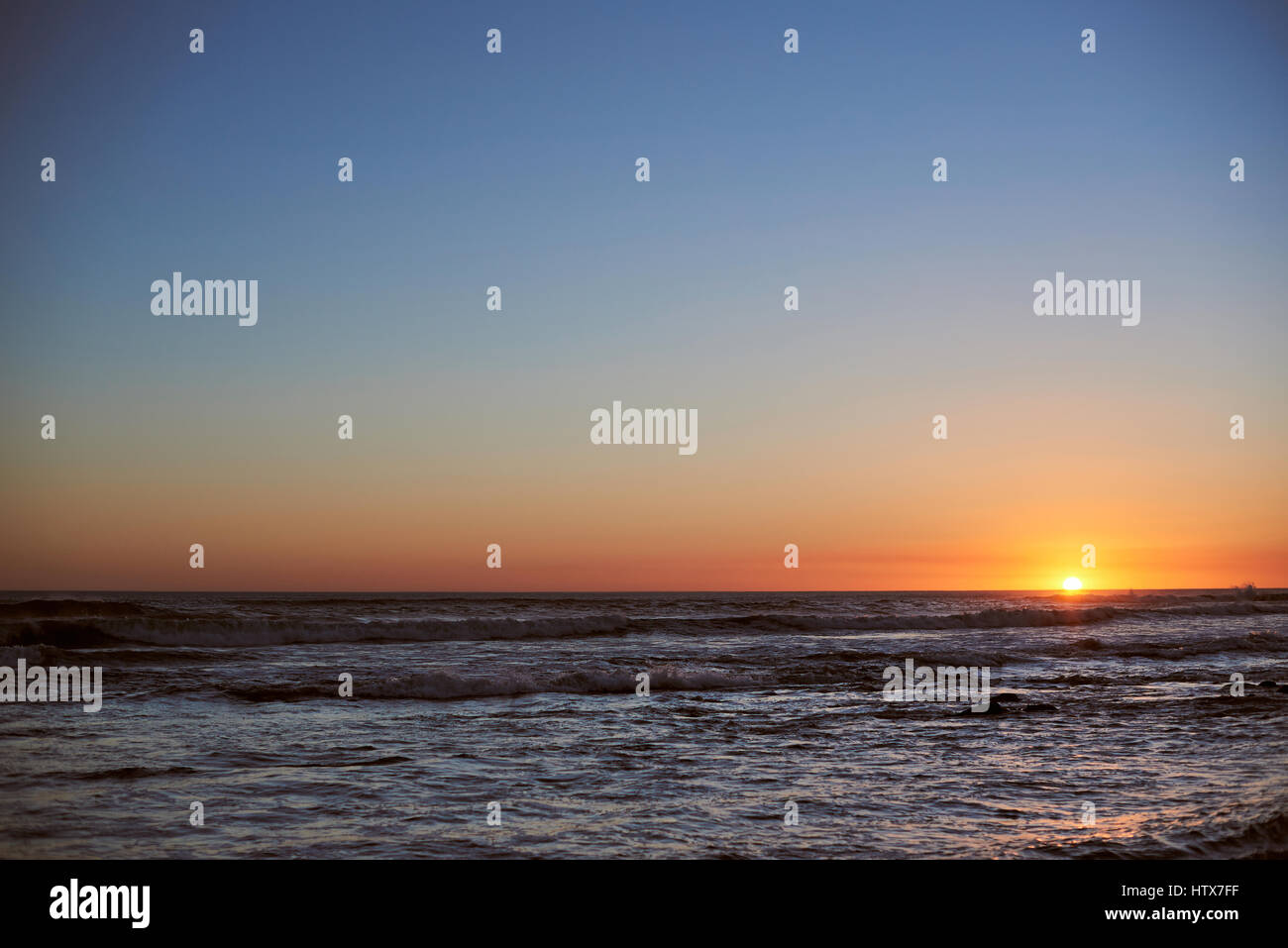 Sunset clean sky in ocean sea scape. Panorama seascape in sunset light Stock Photo