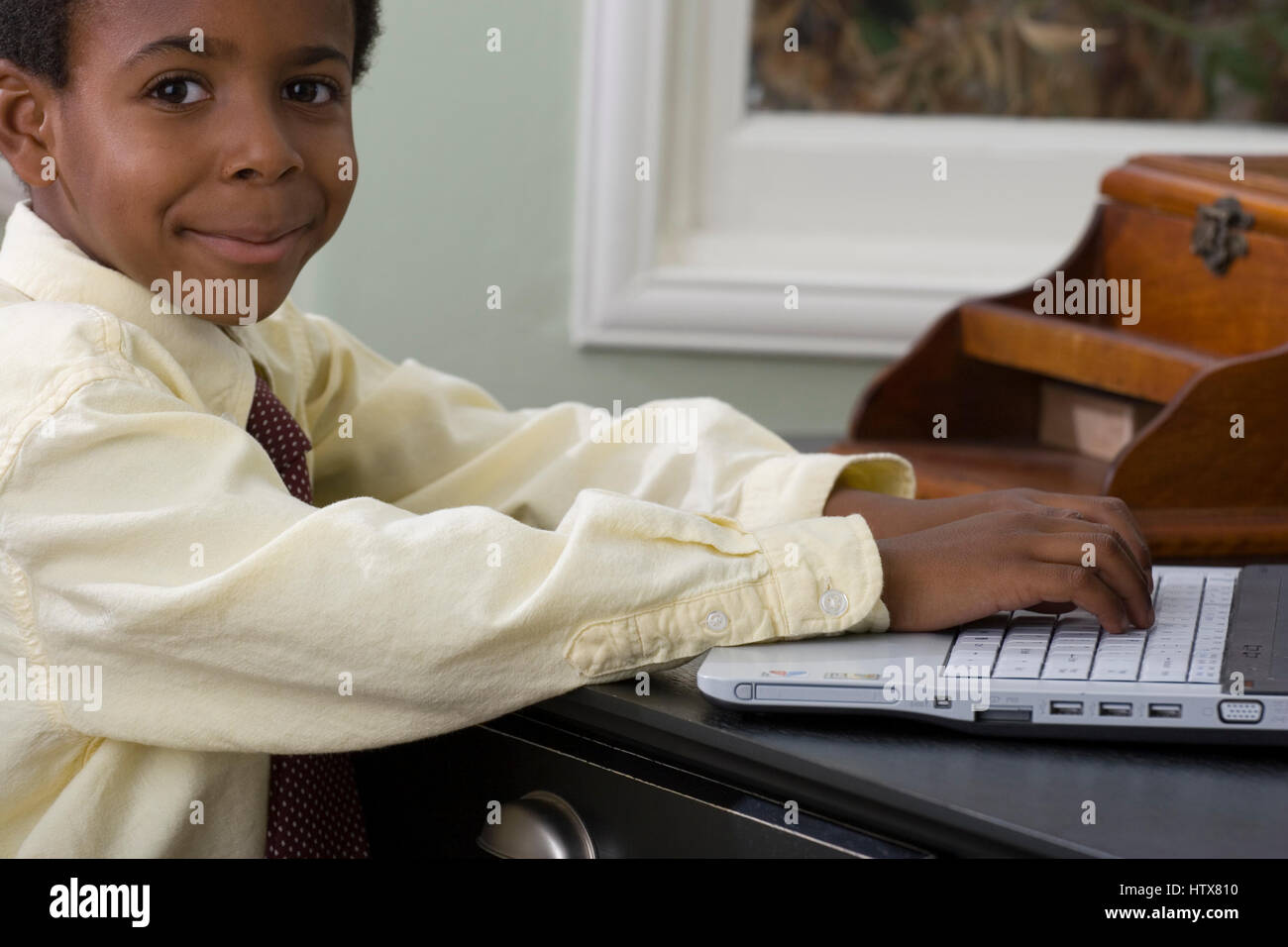 Little boy working on the computer at home Stock Photo - Alamy