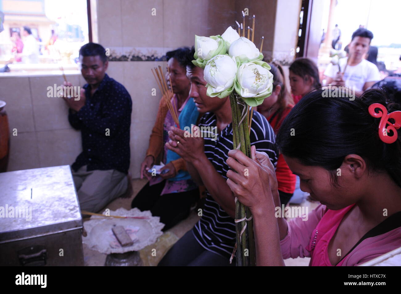 Inside Riverside Res Praying with lotus flowers hi-res stock photography and images - Alamy
