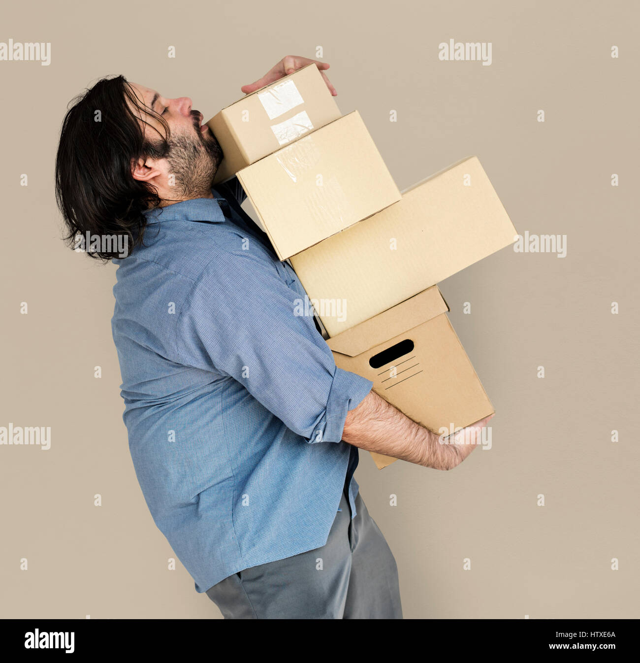 Man Carrying Box Parcel Package Overload Stock Photo
