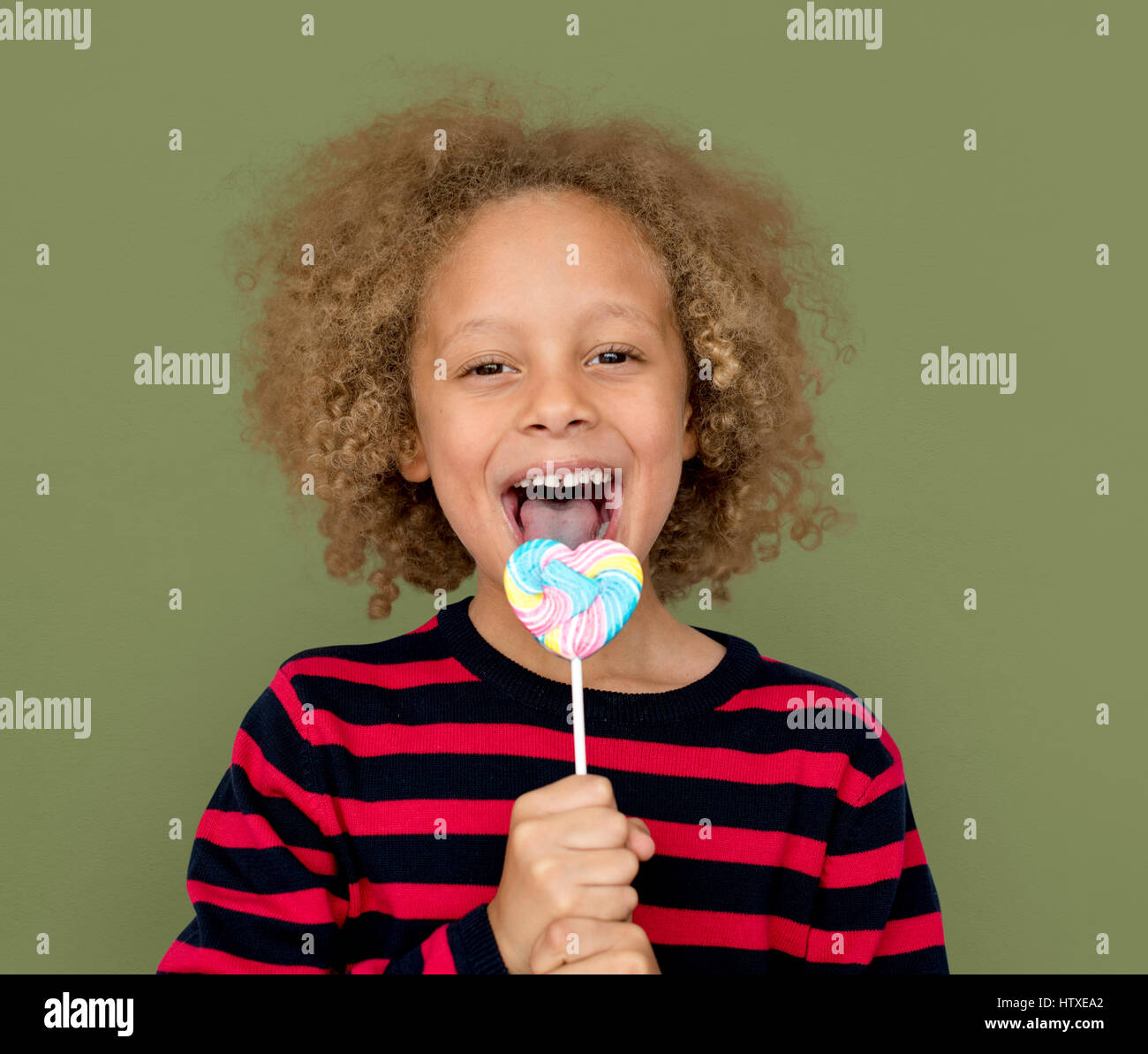 Little Boy Eating Lollipop Candy Stock Photo - Alamy