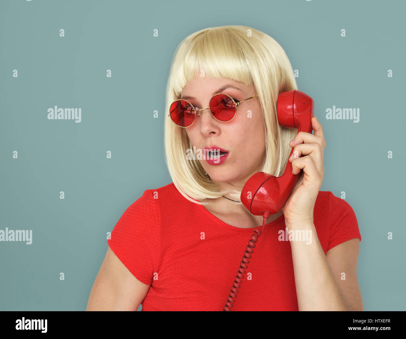 Caucasian Blonde Woman Answering Phone Stock Photo