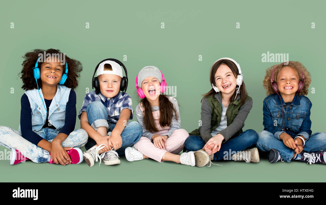 Group of Children Studio Smiling Wearing Headphones and Winter Clothes ...