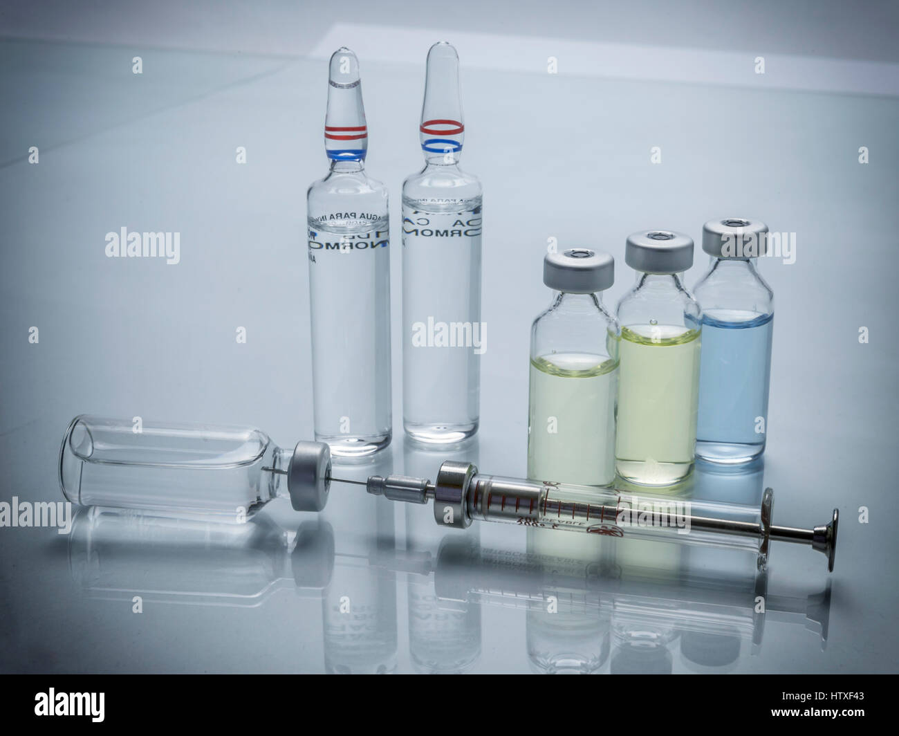 Medicine in vials and syringe ready for vaccine injection Stock Photo