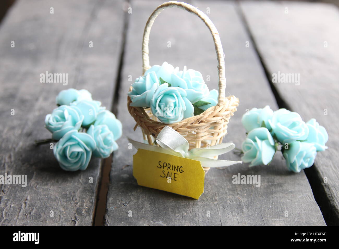 Spring sale tag and flowers in a small basket. Vintage Retro Or Rustic ...