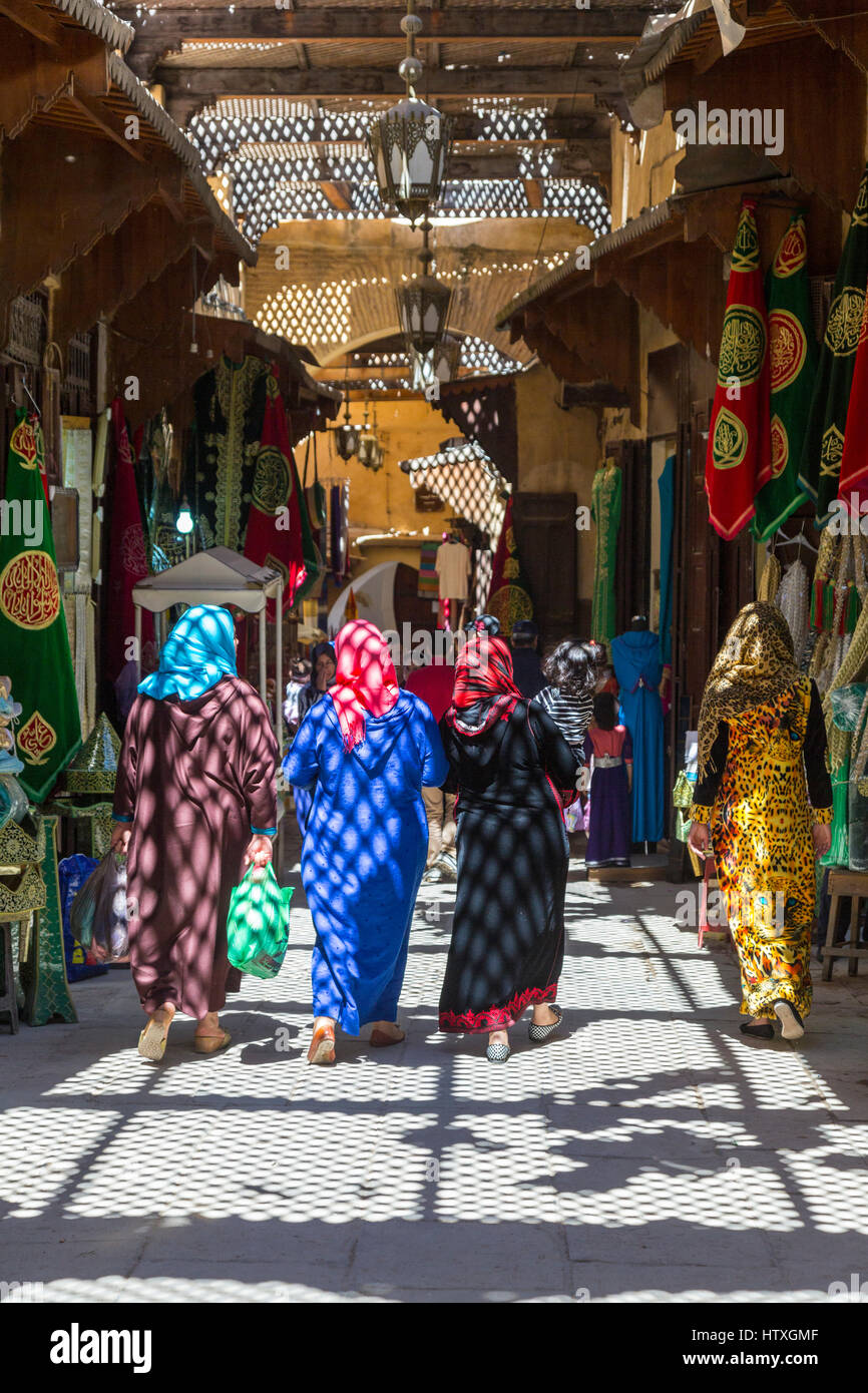 Fes, Morocco.  Street Scene in Fes El-Bali (Old City).  Women Walking. Stock Photo