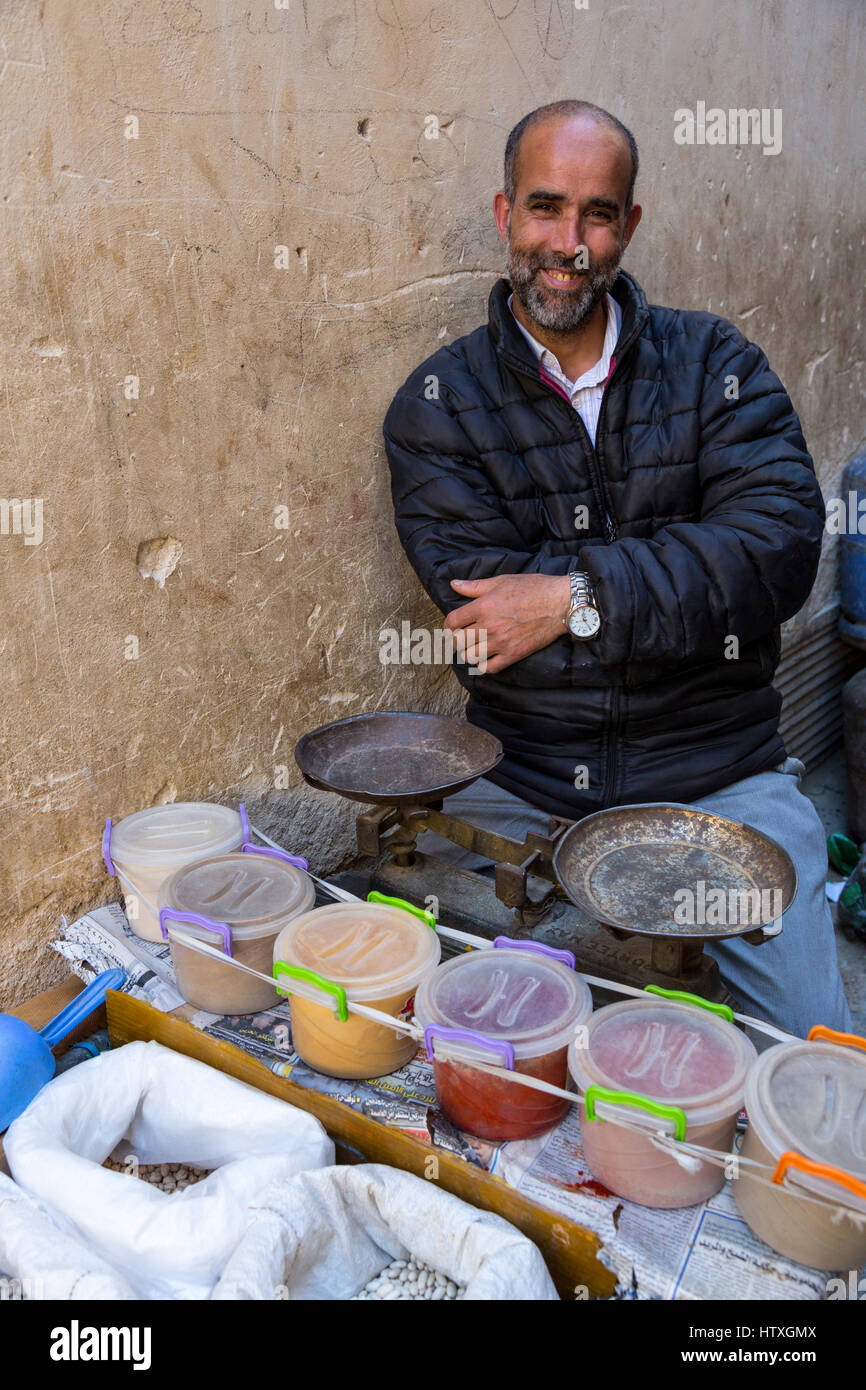 Fes, Morocco.  Vendor of Beans, Nuts, and Spices at his Stand in the Old City. Stock Photo