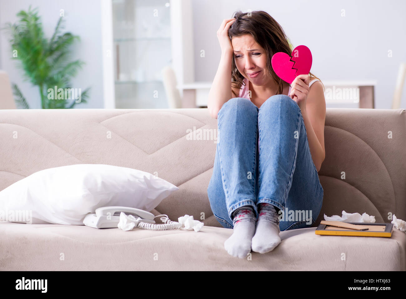 Broken woman heart in relationship concept Stock Photo - Alamy