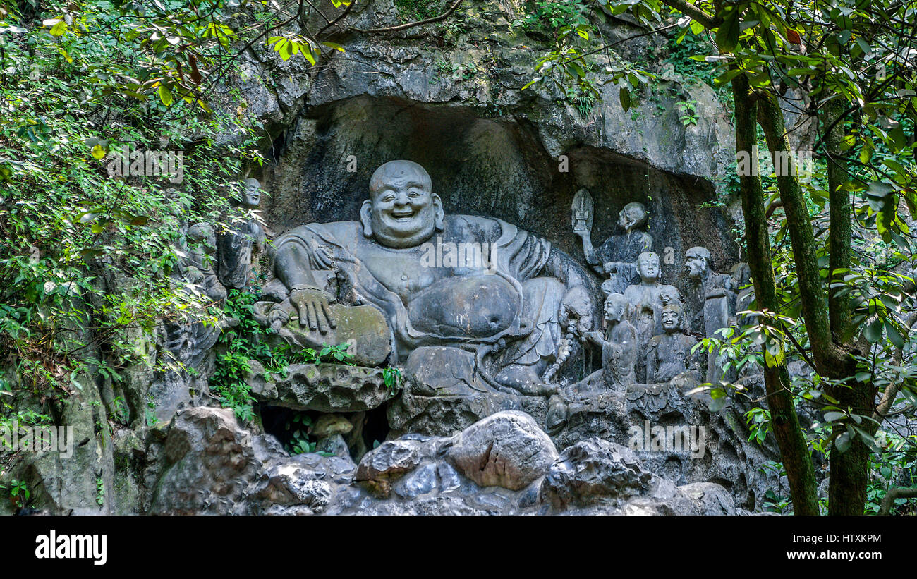 China, Hangzhou. Monastery Soul SanctuaryTemple (Lininsy). Sculpture laughing Buddha - Hotei. It is believed that touching the stomach sculpture bring Stock Photo