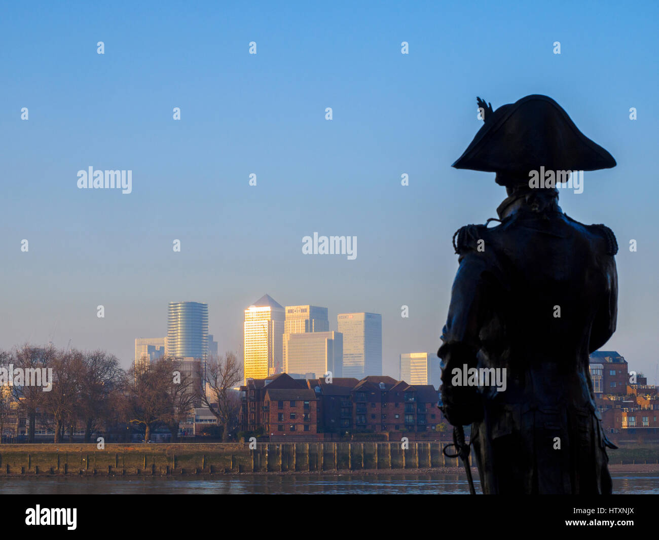 Nelson statue at Trafalgar Pub in Greenwich and Canary Wharf in the background - London, England Stock Photo
