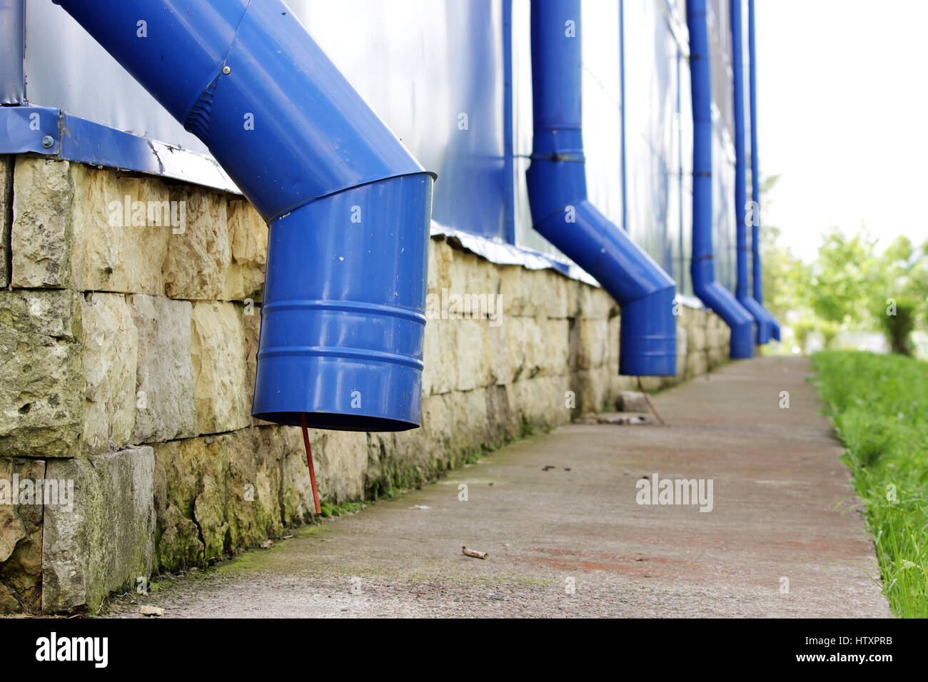 Blue water pipes on a large sports complex in summer. concept of