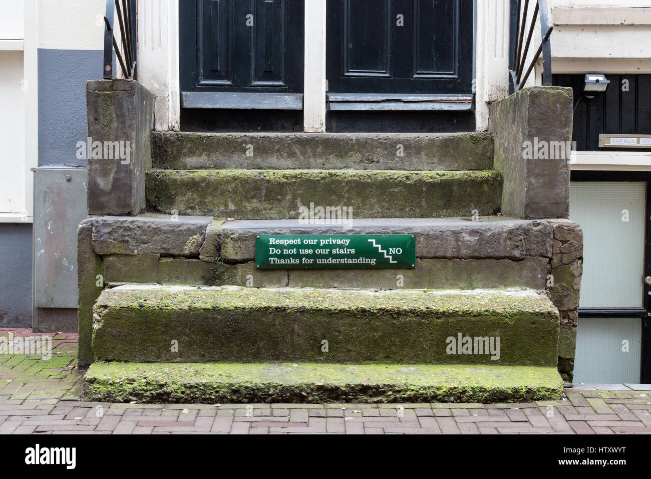 Sign on private stairs in Amsterdam, close to the Leidseplein, asking tourists to respect the privacy of the residents Stock Photo