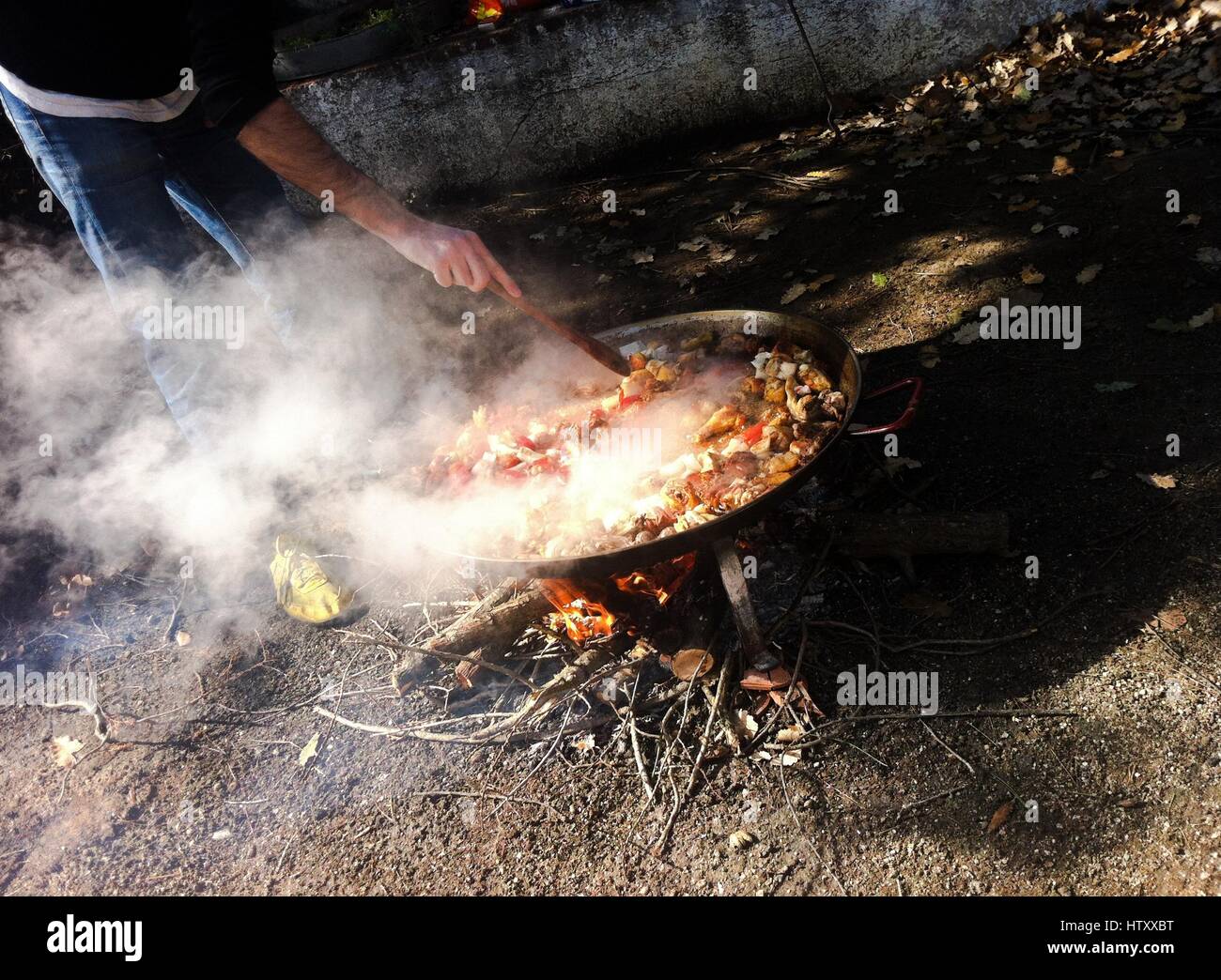 Man cooking paella Stock Photo