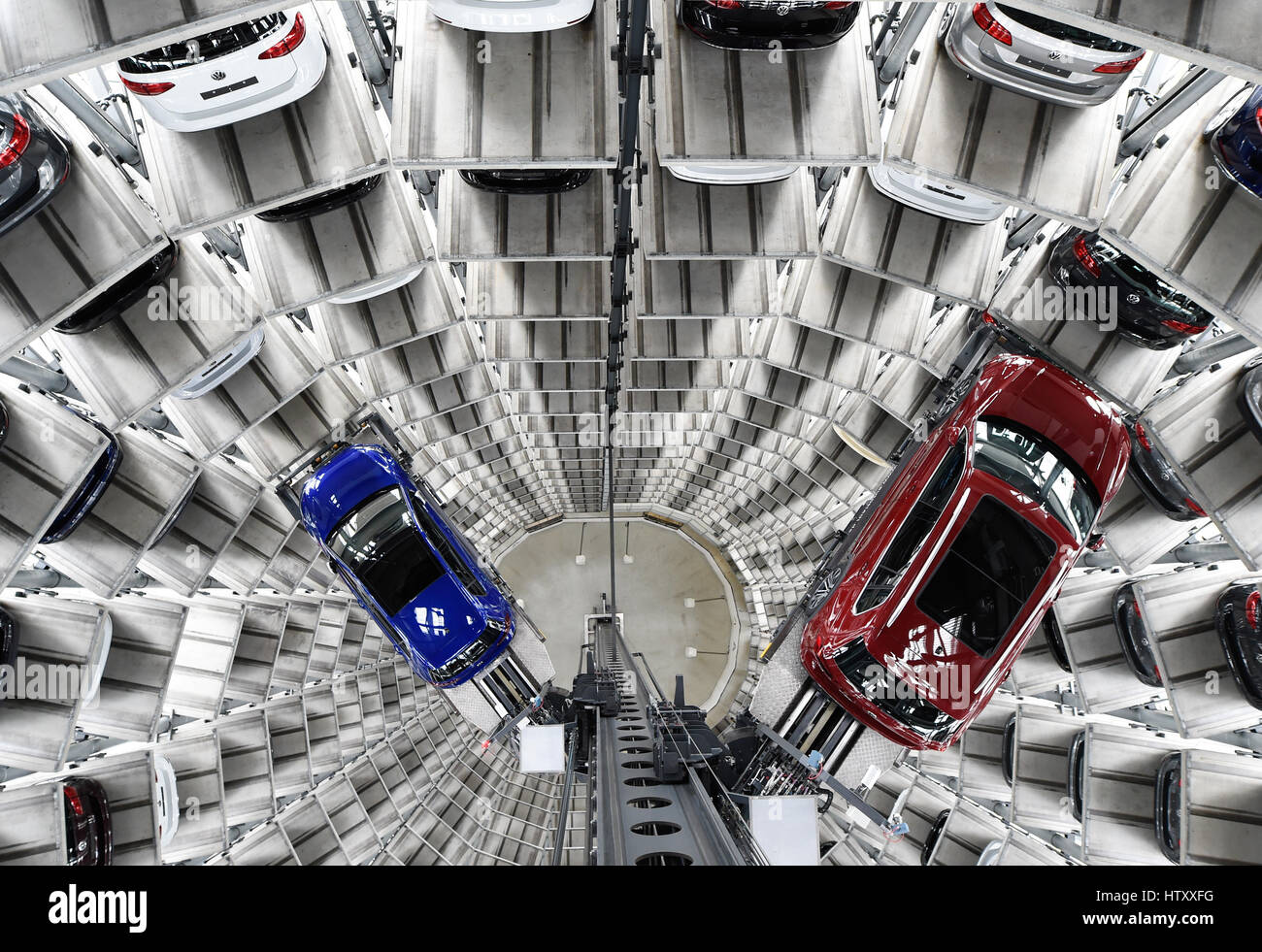 Volkswagen Golf cars are loaded in a delivery tower at the companies headquarter in Wolfsburg, March14, 2017. VW Golfs in einem Auslieferungsturm in W Stock Photo