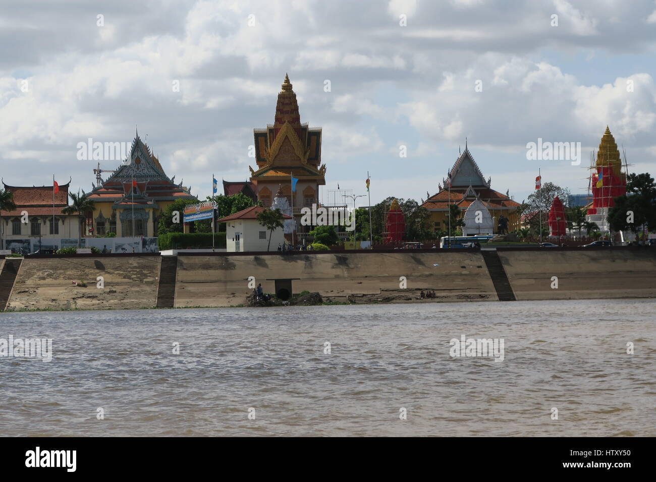 View at Phnom Penh from speedboat, dirty, brown, river Mekong, Cambodia, mighty house Stock Photo