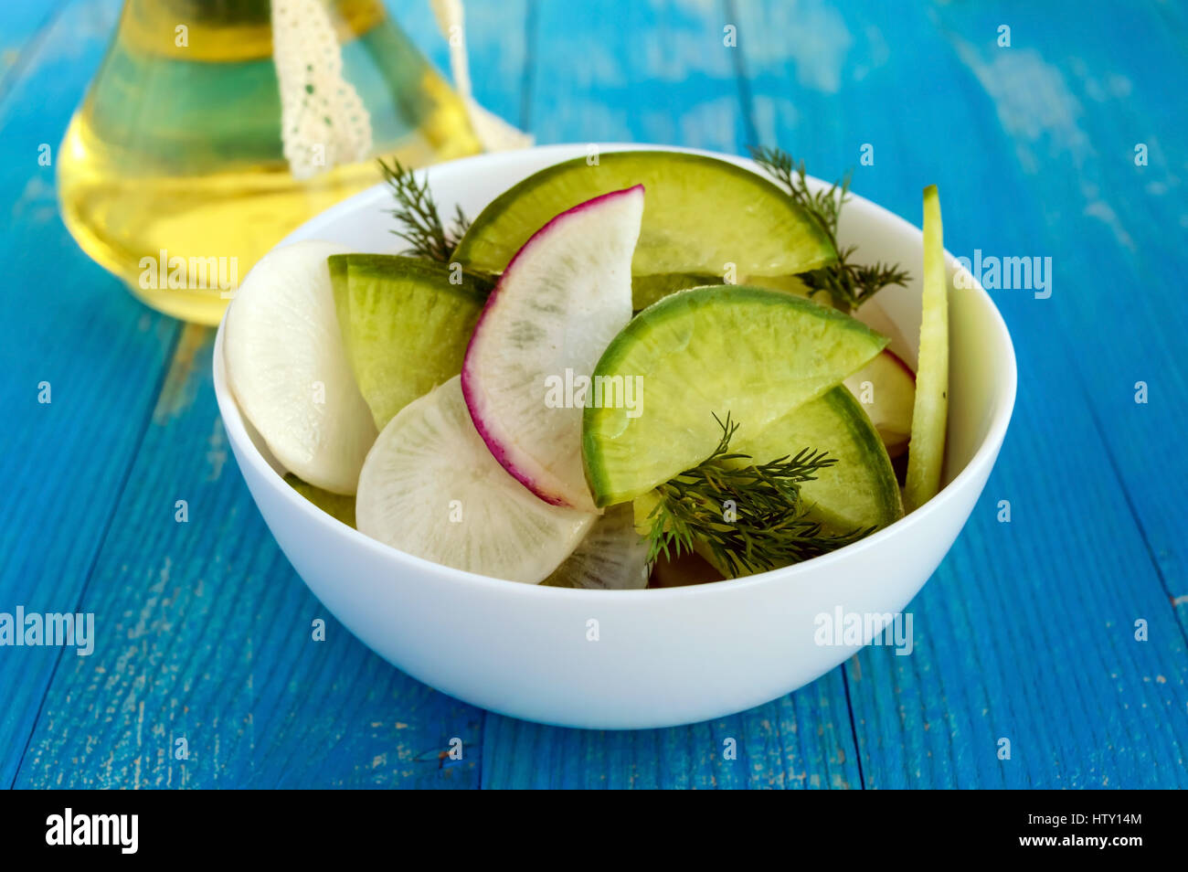 Salad of radish of different varieties (daikon, green, Chinese red