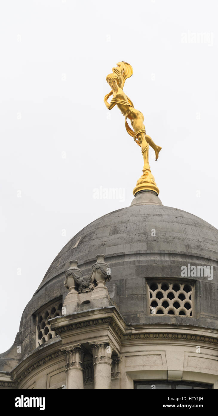 Golden statue atop a dome at the Bank of England, London. Stock Photo