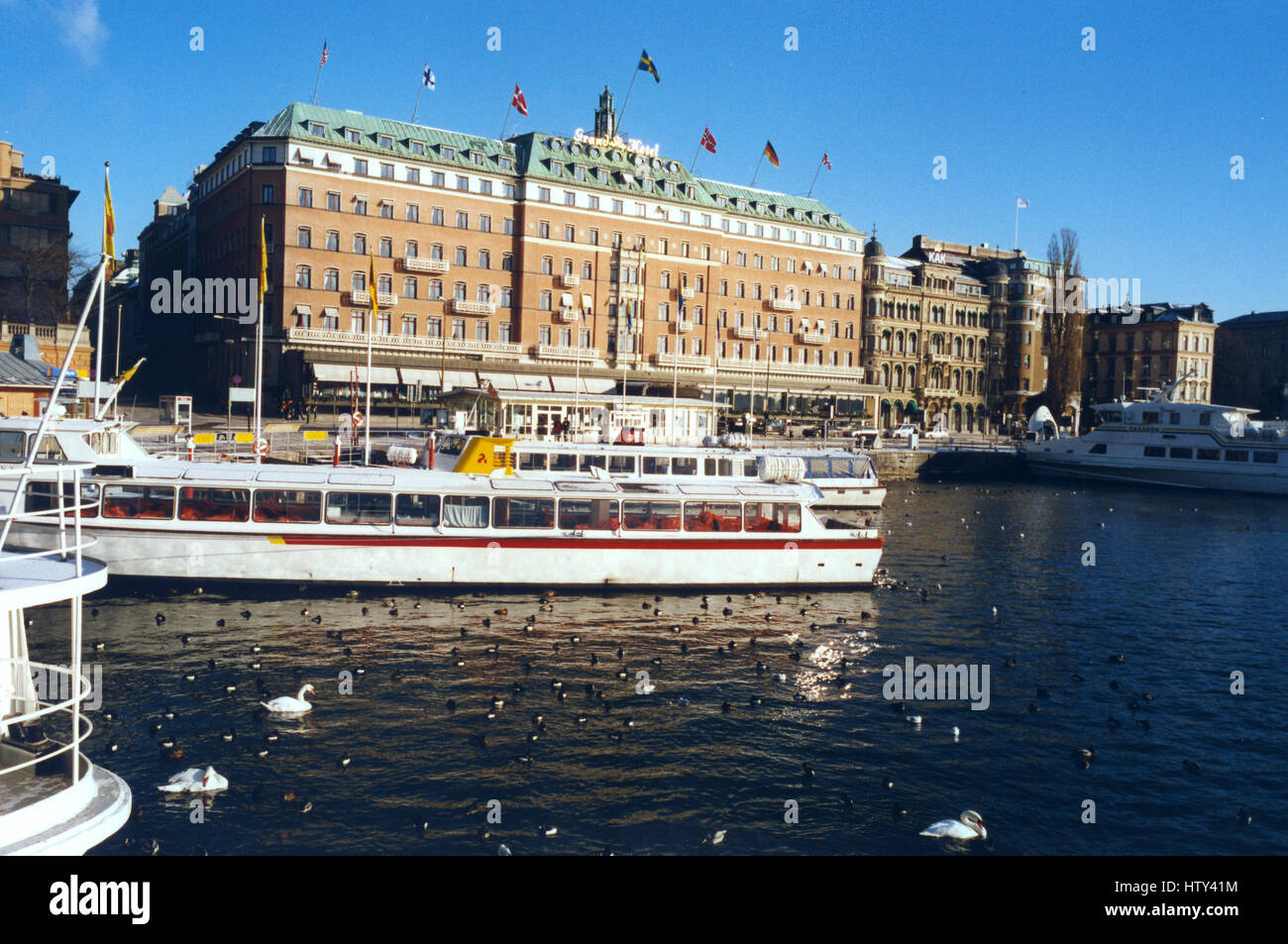 GRAND HOTEL Stockholm by the water with boats and birds 2001 Stock Photo