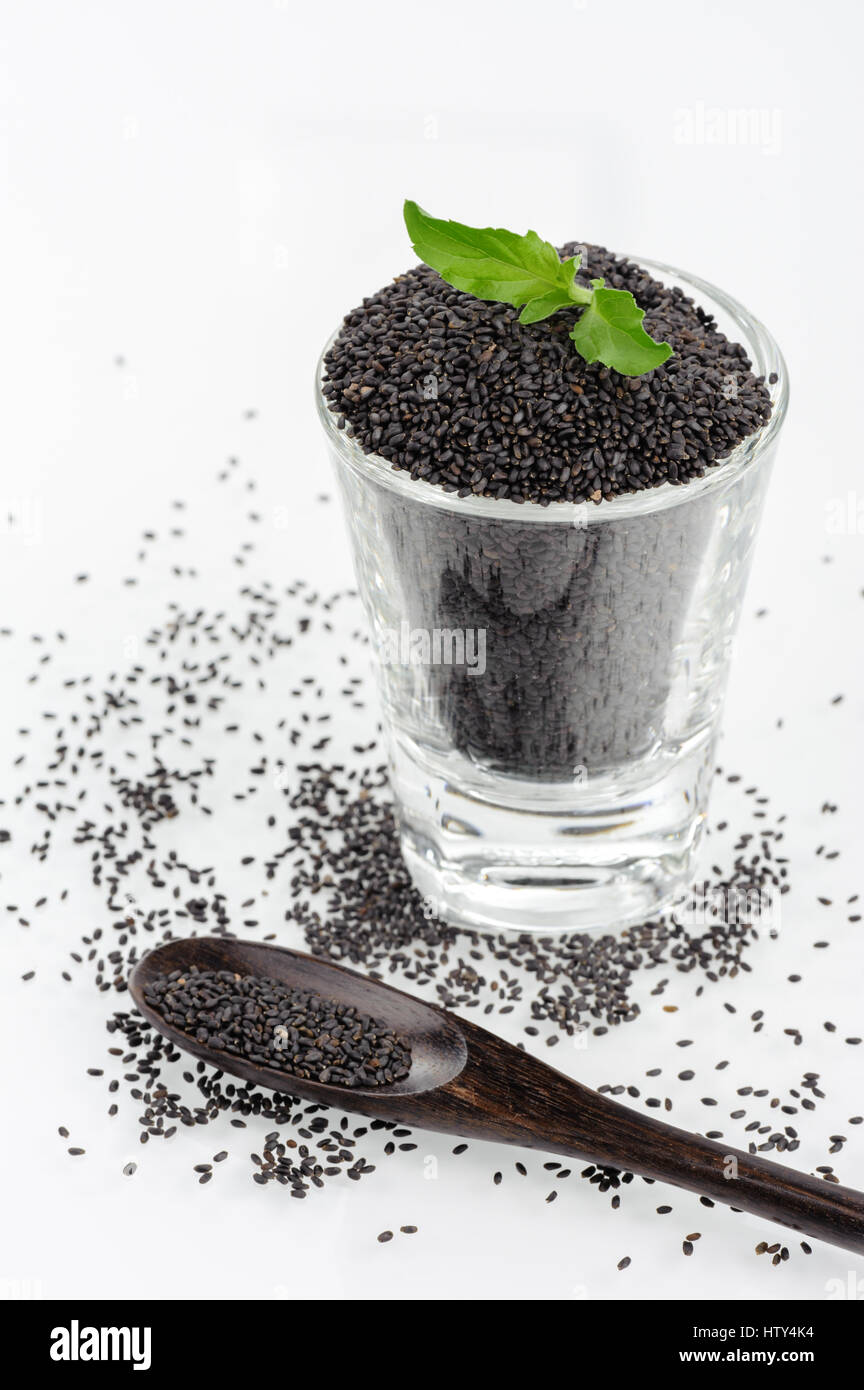 closeup sweet basil seeds on white background Stock Photo - Alamy