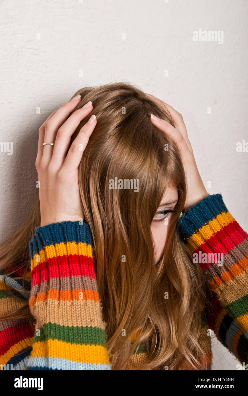 blond girl afraid, domestic violence concept Stock Photo