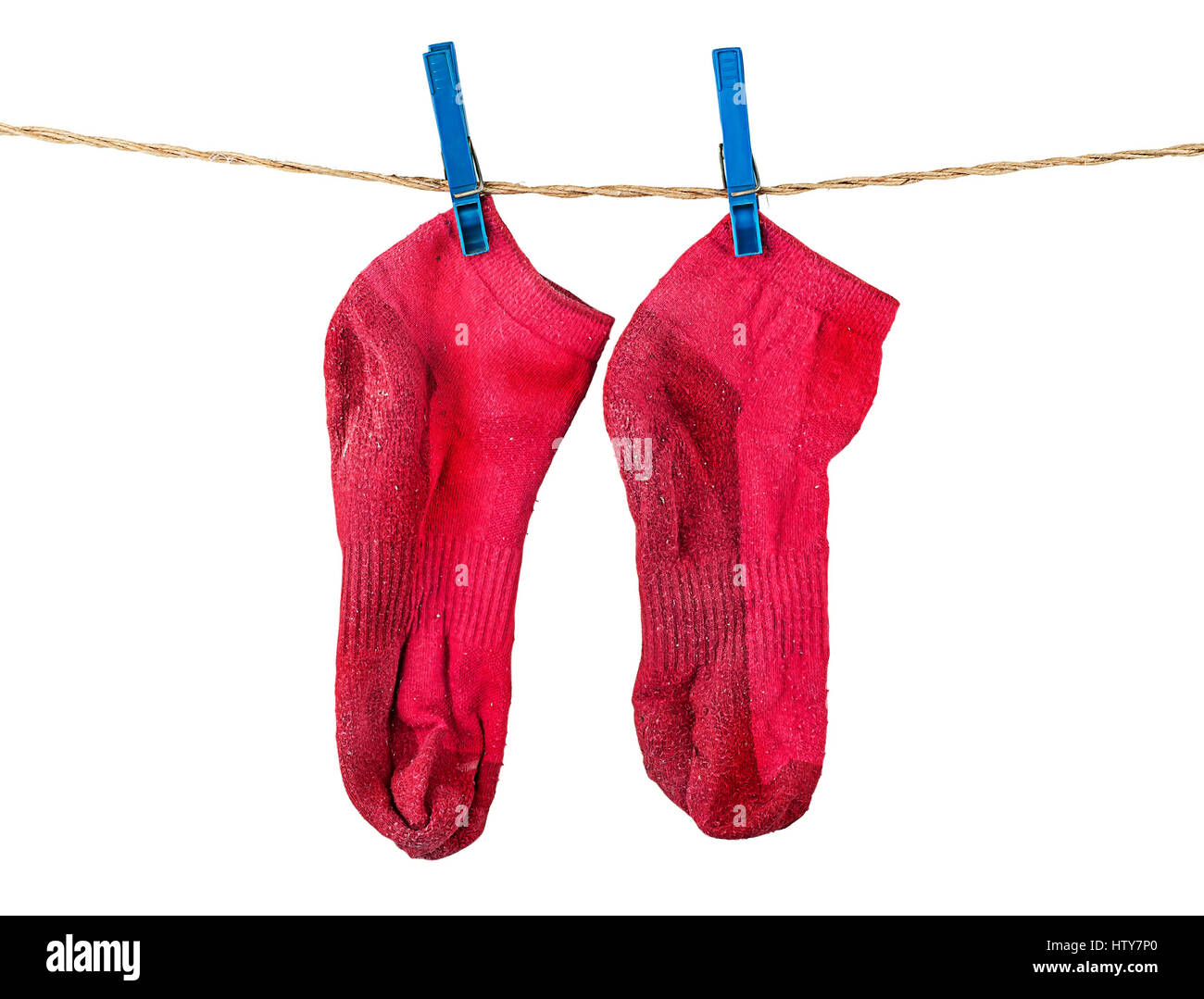 Pair of washed red socks on rope isolated on white background Stock ...