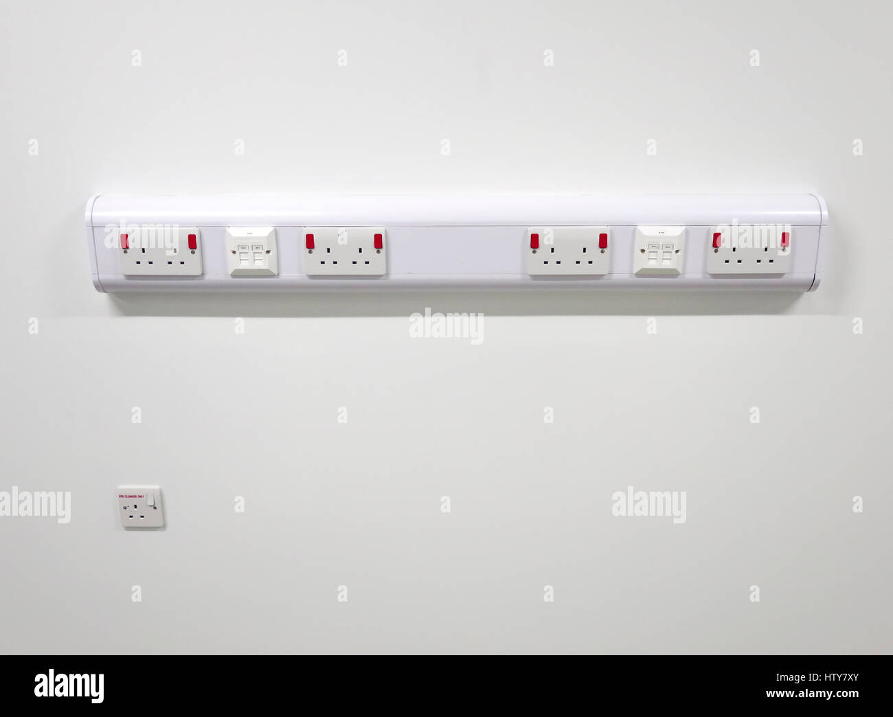 Power and data outlets on plastic wall trunking Stock Photo Alamy