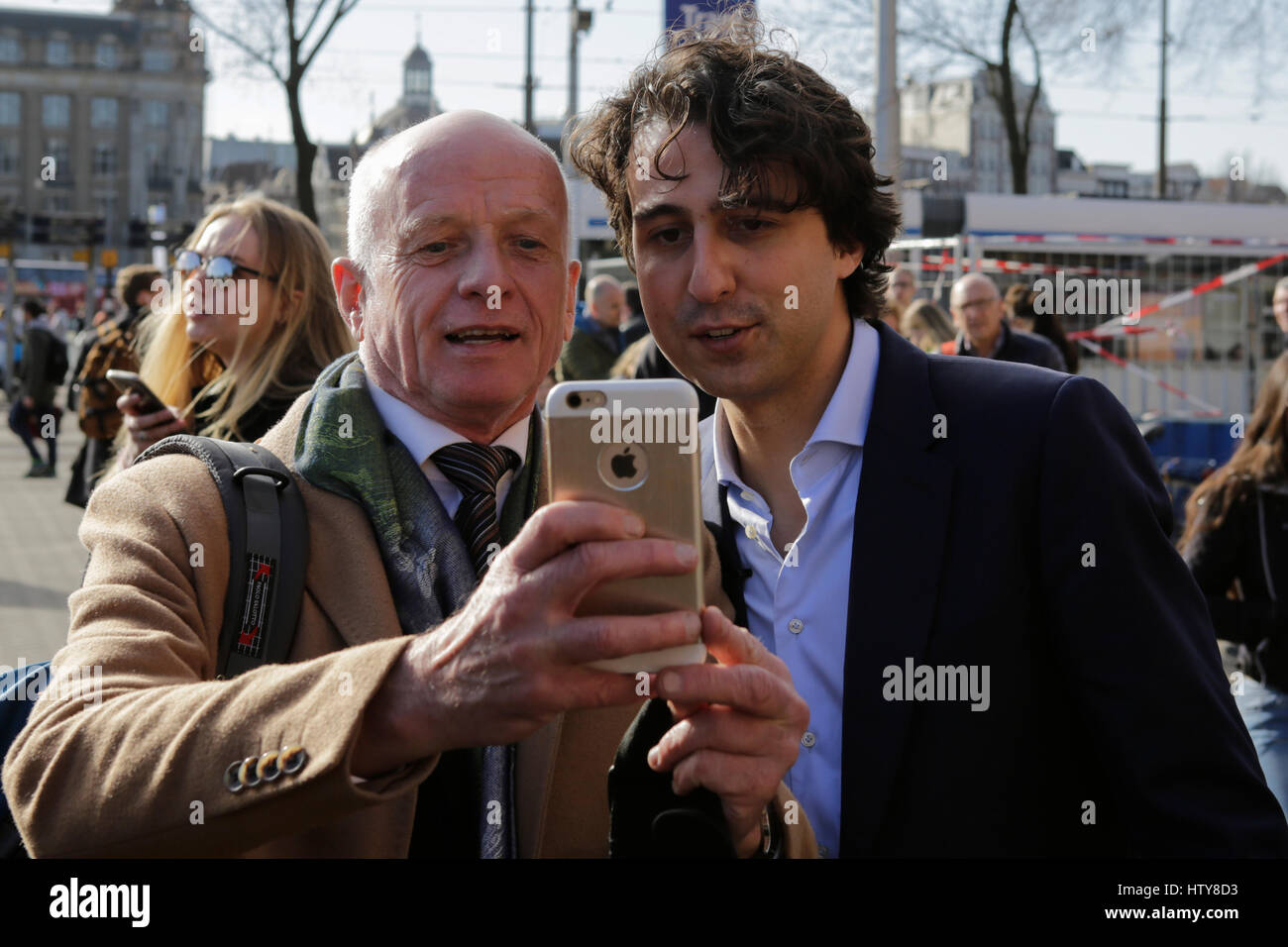 Amsterdam, Netherlands. 15th Mar, 2017. A voter took a selfie with Jesse Klaver, the party leader of the GroenLinks, he also canvasses together with a number of GroenLinks volunteers outside the Amsterdam Central Station to pursue the undecided voters to vote for his party in the Dutch general election. Credit: Michael Debets/Pacific Press/Alamy Live News Stock Photo