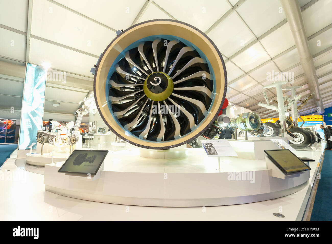 Exhibition stands displaying jet engines and other components used in the aviation industry at Farnborough, UK Stock Photo