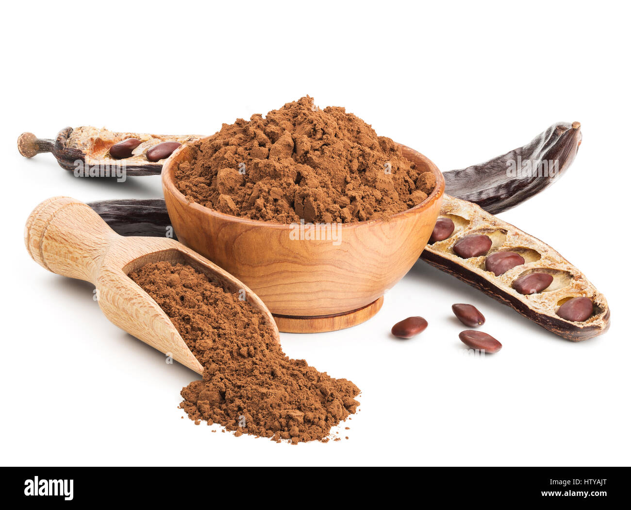 Ground carob and pods isolated on white Stock Photo