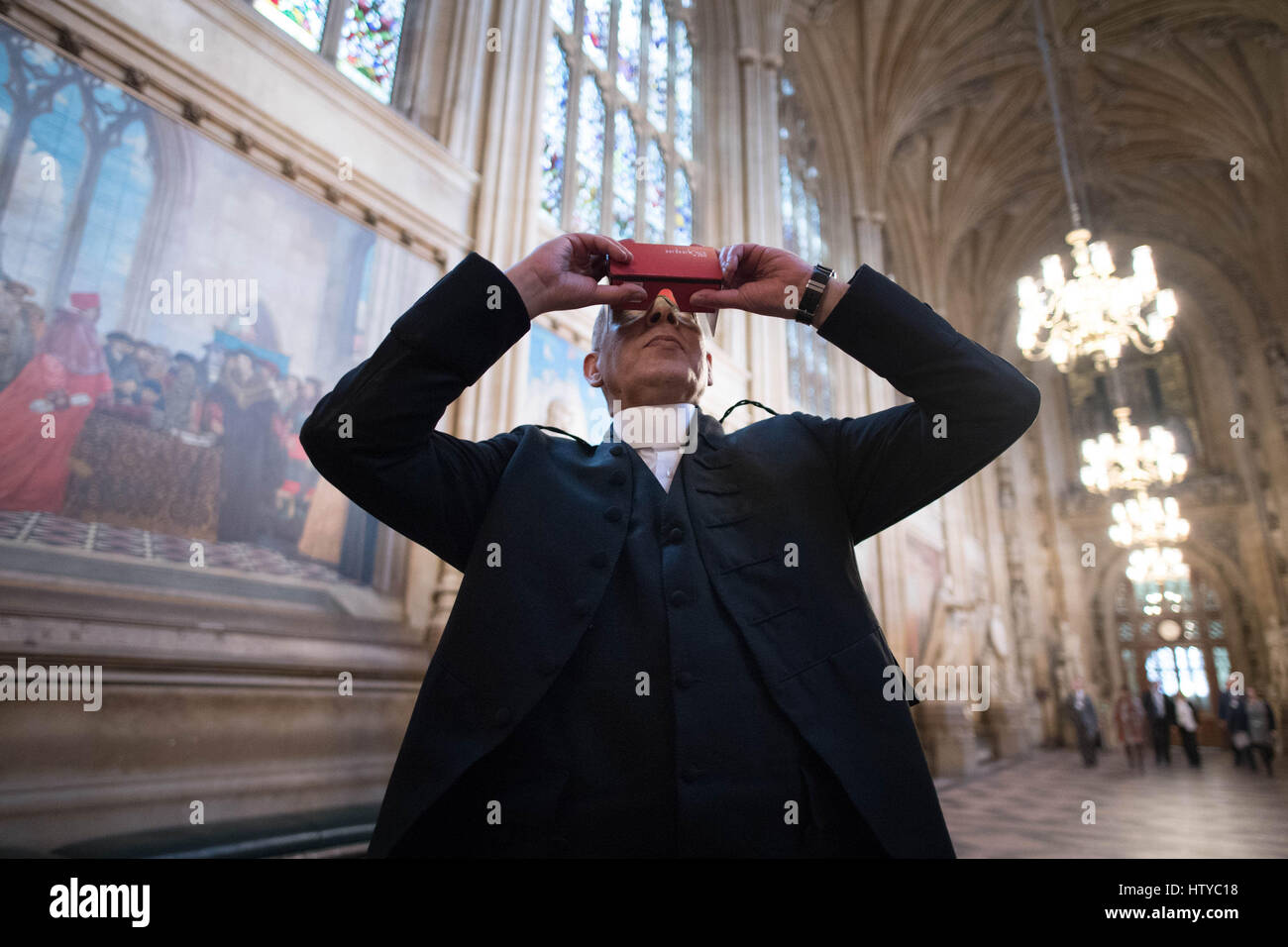 House of Commons Serjeant at Arms Kamal El-Hajji tries a new 360 degree headset which allows people to have a virtual reality tour of the Houses of Parliament in London using their smart phone from anywhere in the world. Stock Photo
