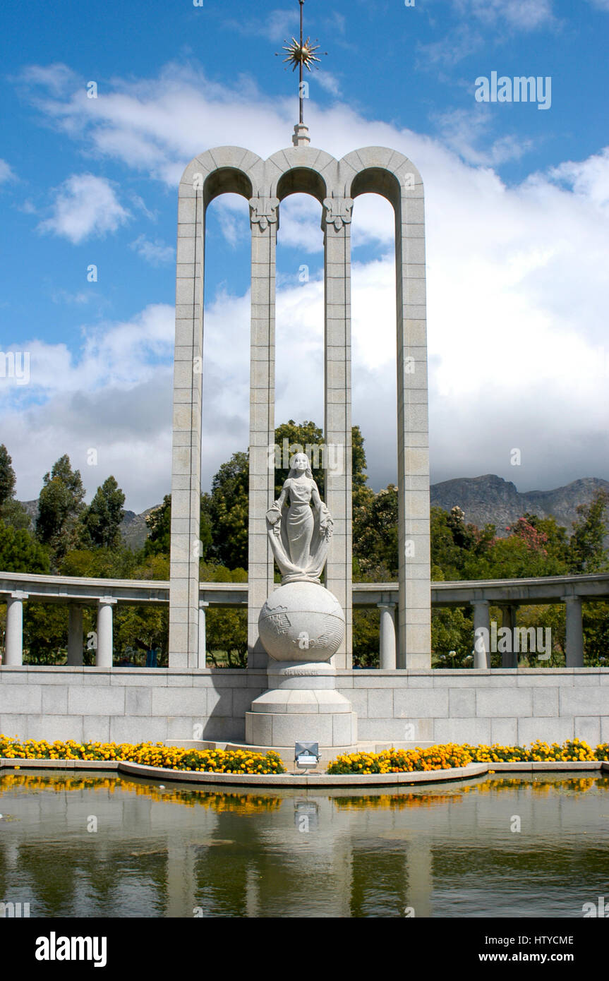 Huguenot Monument with clouds and Franschhoek Pass mountains in background, Franschhoek, South Africa Stock Photo