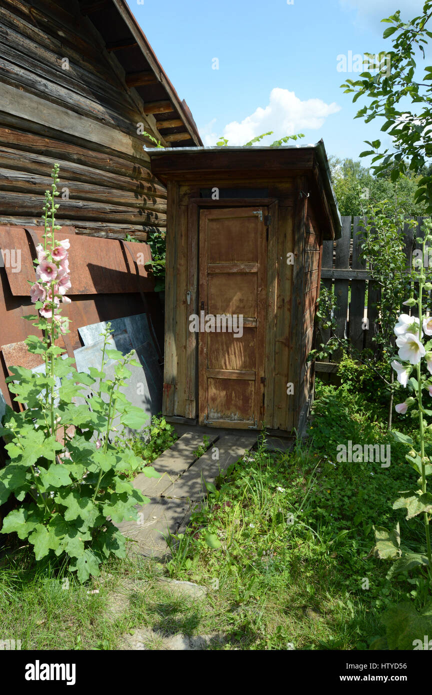 KOVROV, RUSSIA - JULY 18, 2015: Toilet in the courtyard of a single storey wooden house Stock Photo