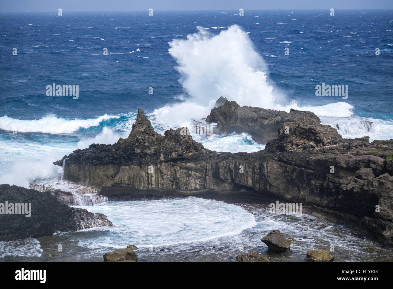 Waves crashing on rocks, Batanes, Philippines Stock Photo