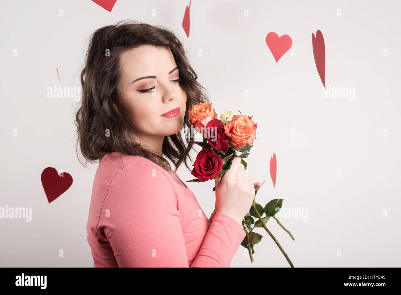 Woman holding roses Stock Photo - Alamy