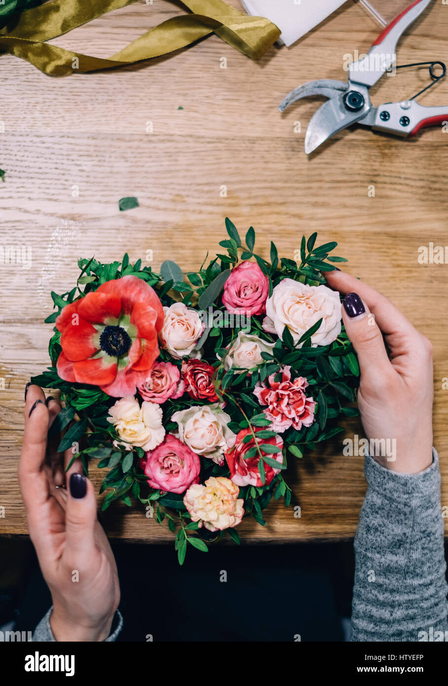 Woman making a flower arrangement Stock Photo