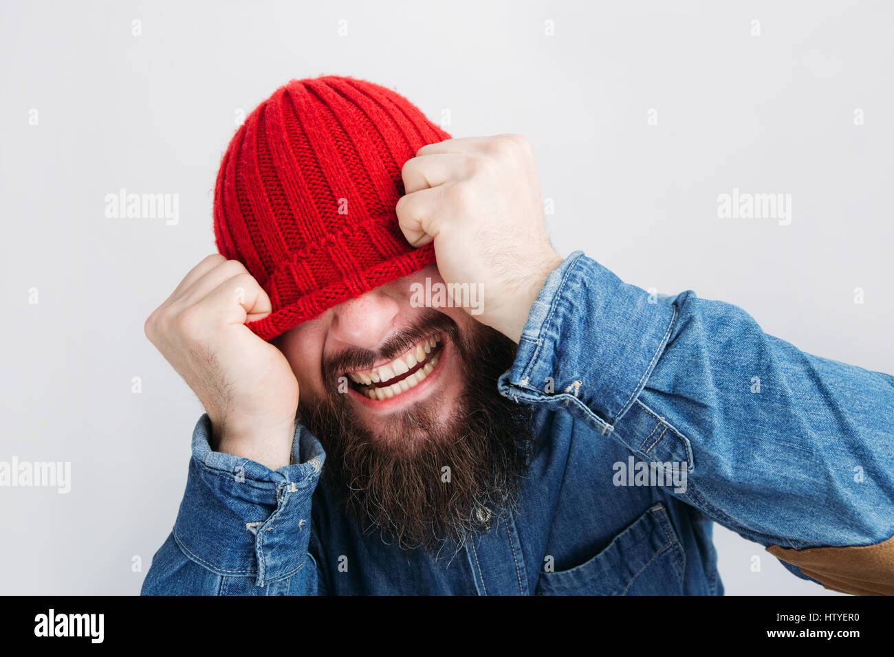 Pulling beanie over his face hi-res stock photography and images - Alamy