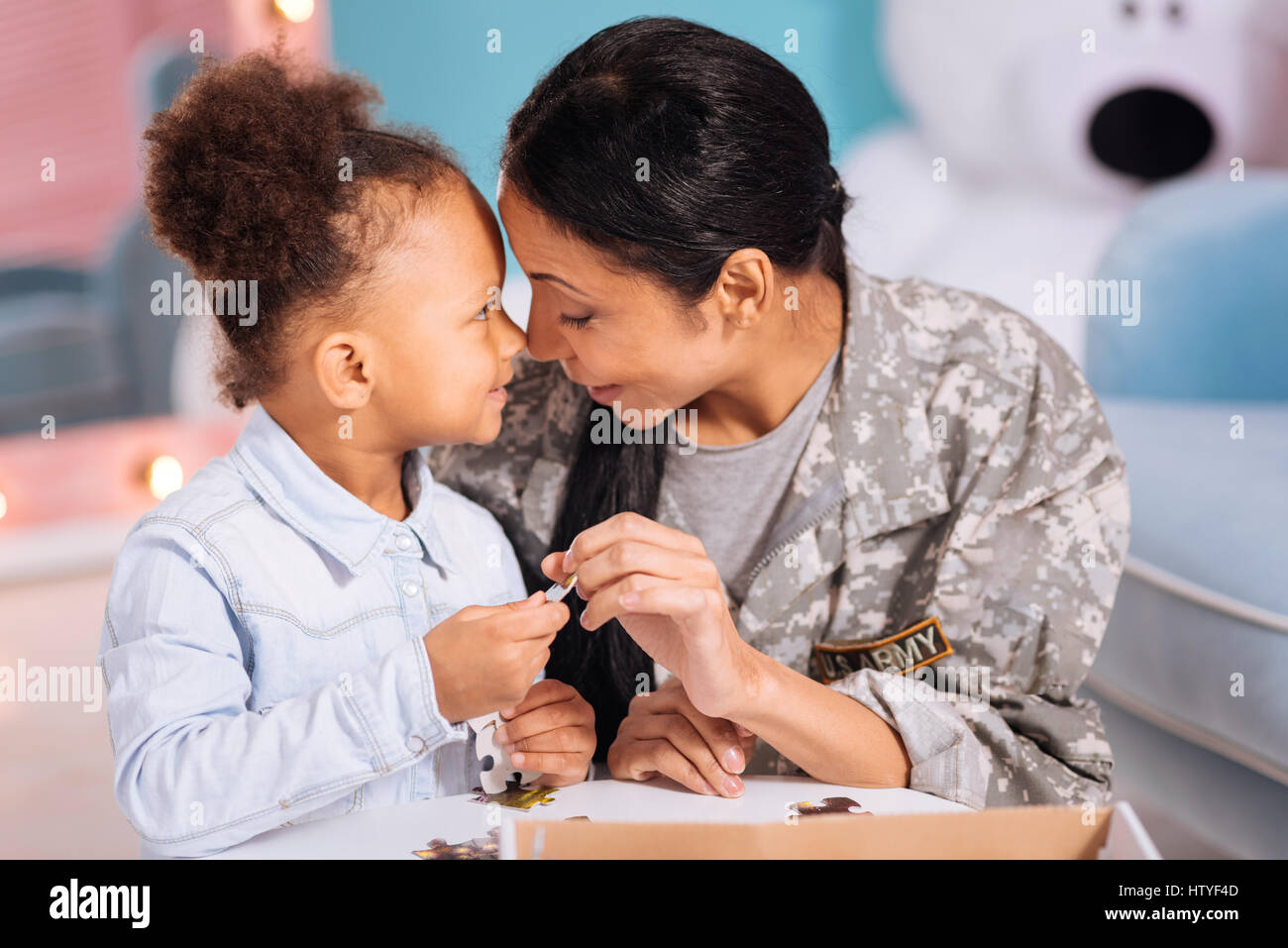 Stunning mom and daughter sharing a family moment Stock Photo