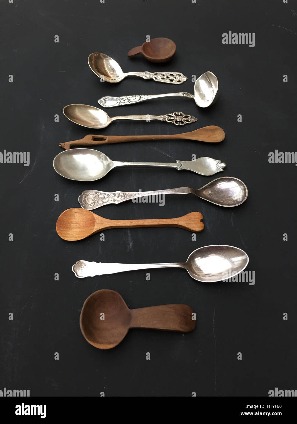 Selection of metal and wooden spoons Stock Photo
