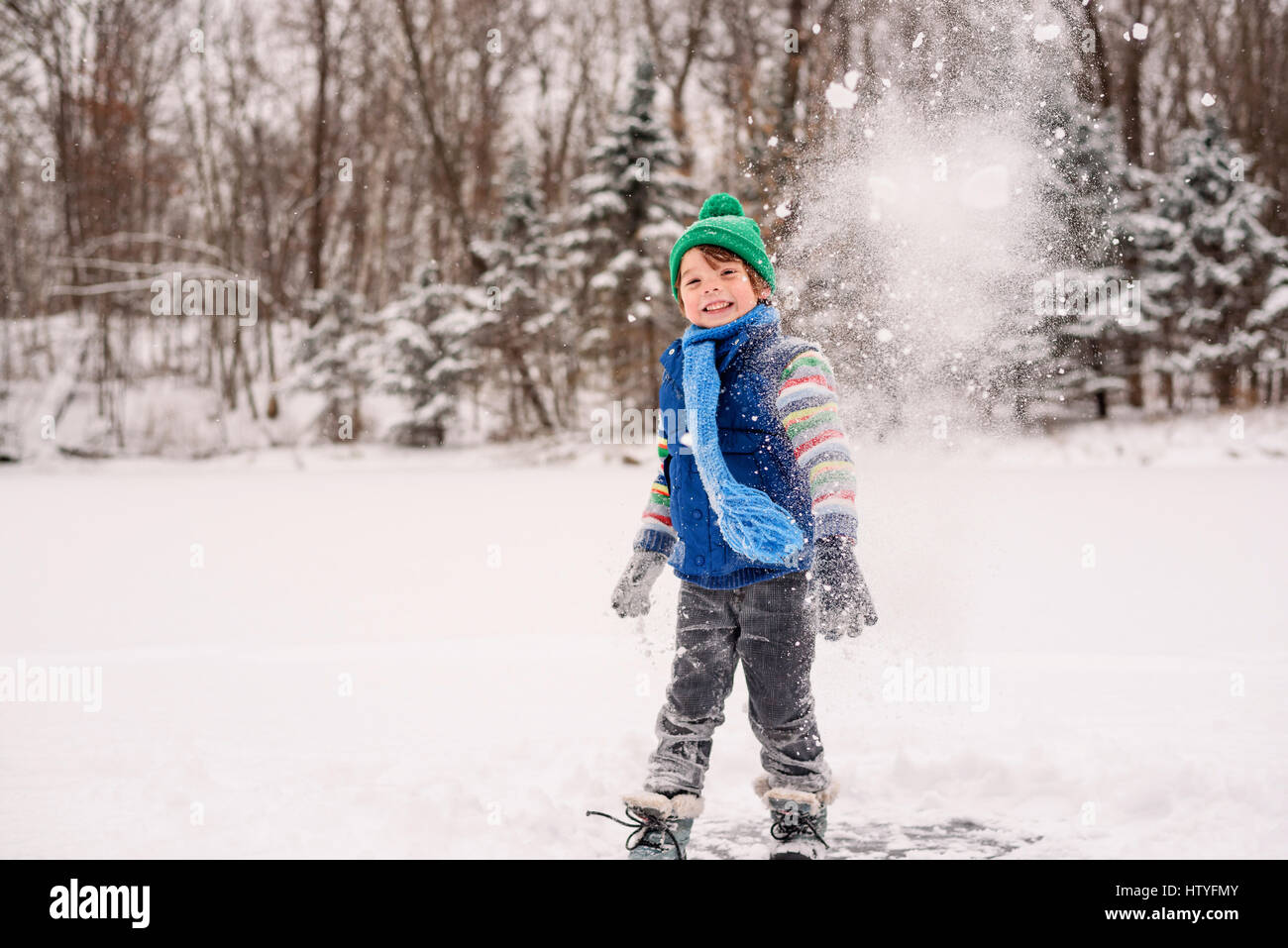 Boy throwing a snowball Stock Photo