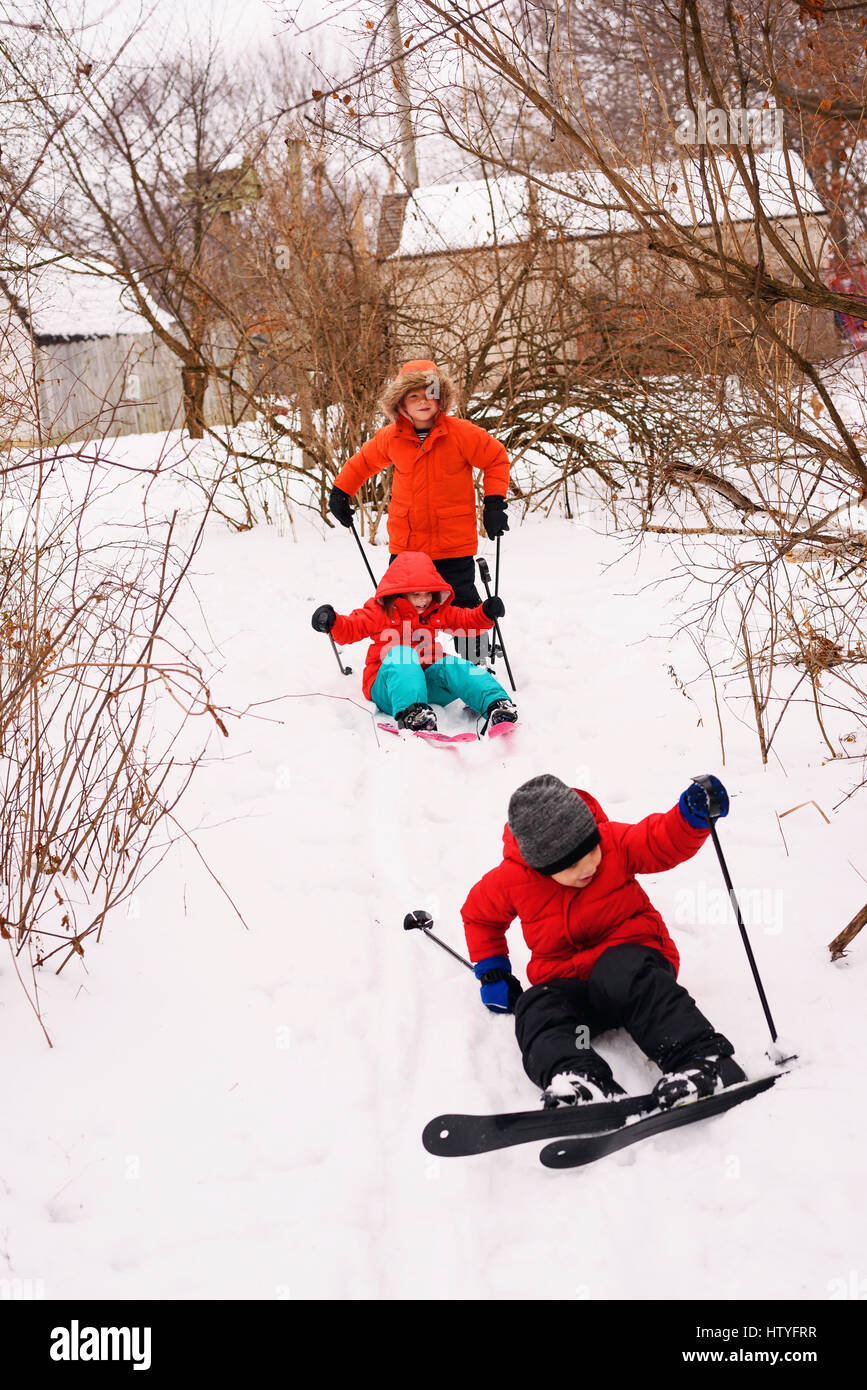 Three children learning to ski Stock Photo