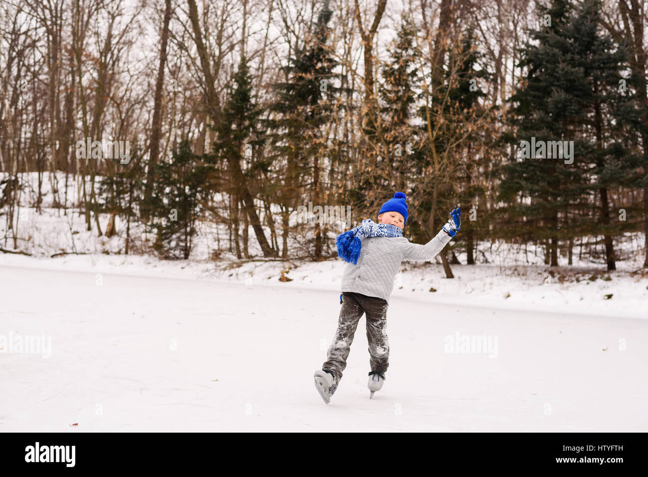 Boy learning to ice skate Stock Photo Alamy