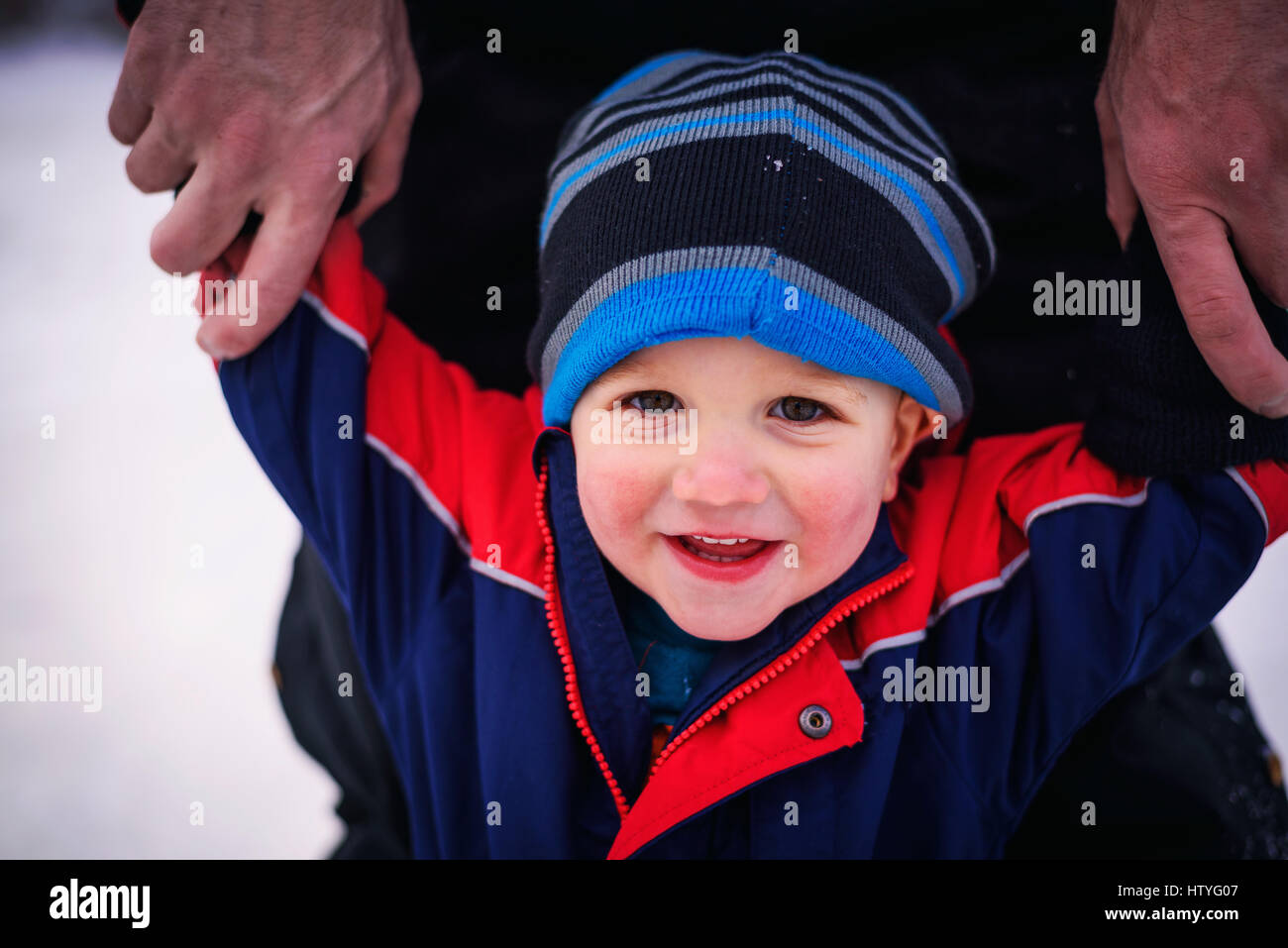 Father Holding His Toddlers Arms Stock Photo Alamy