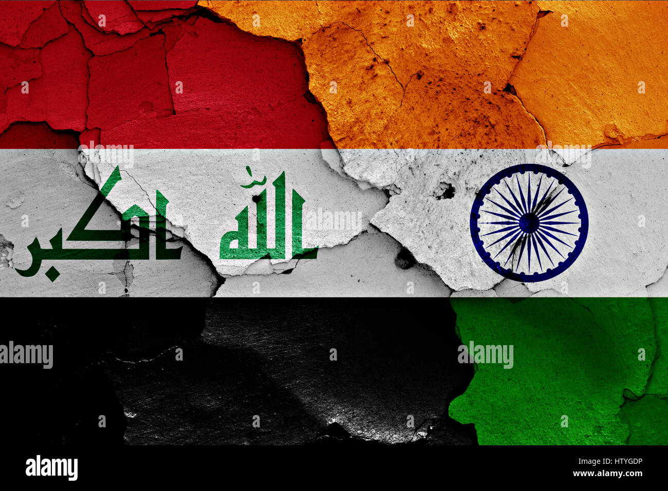 flags of Iraq and India painted on cracked wall Stock Photo
