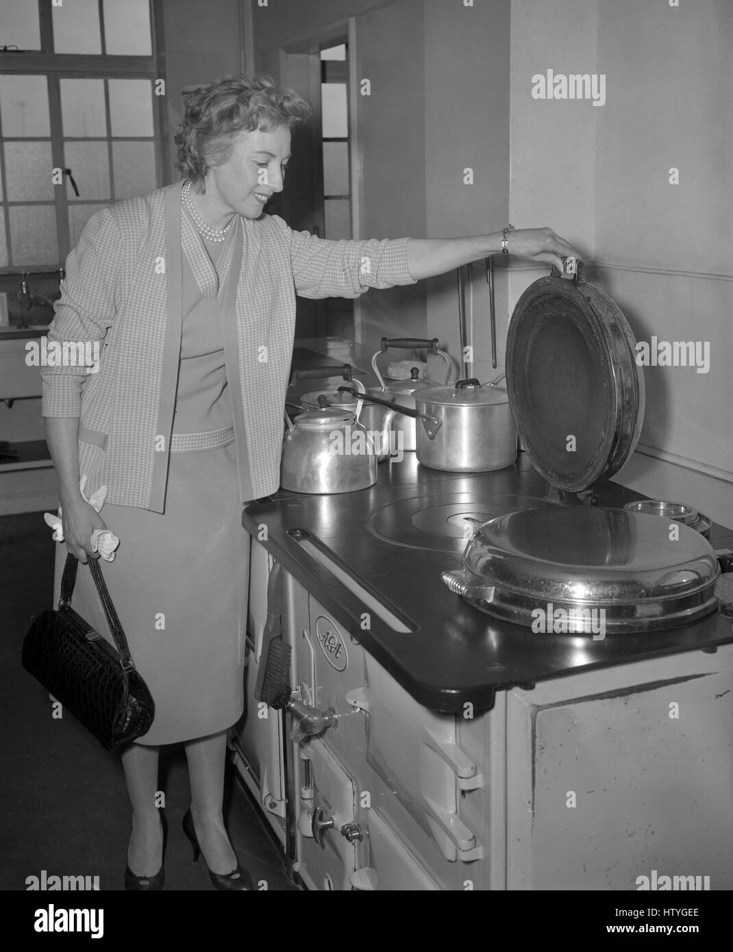 Singer Vera Lynn, who is chairwoman of the Stars Organisation for Spastics, inspects the kitchen of Colwall Court, a former domestic science school at Bexhill-on-Sea, Sussex, which the organisation wants to buy as a holiday home for spastic children. Stock Photo