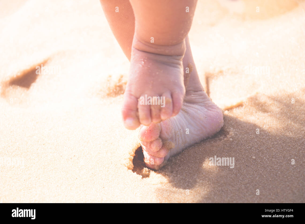 baby footprints in sand