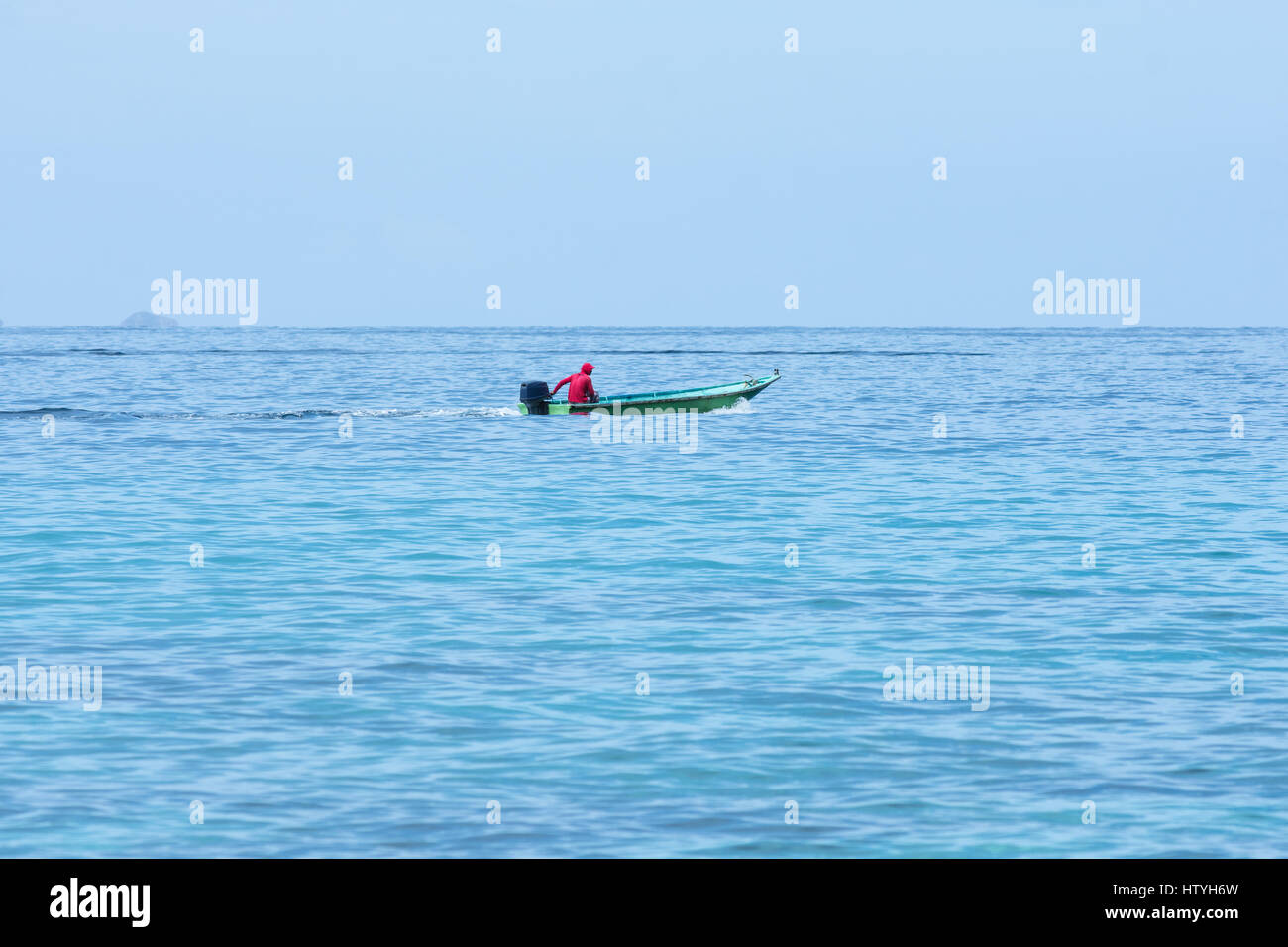 Man riding in a boat hi-res stock photography and images - Alamy